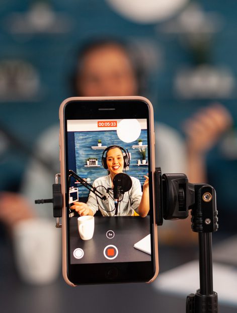 Woman recording a video with her phone