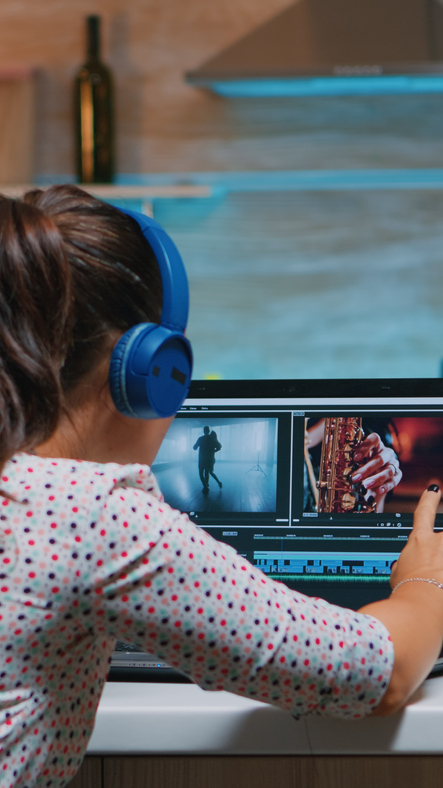 Video editor wearing headset and working from home Shot of a young businesswoman using a digital tablet during a late night at work